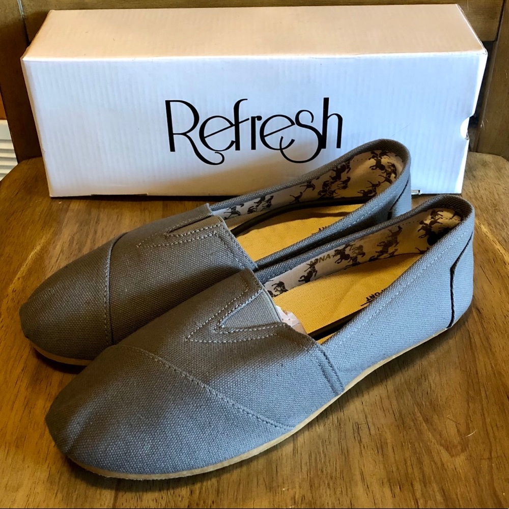 Woman’s charcoal gray slip on shoes